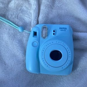 Polaroid camera with the case.